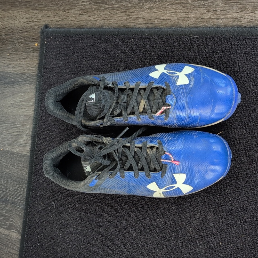 Under armour baseball cleats.